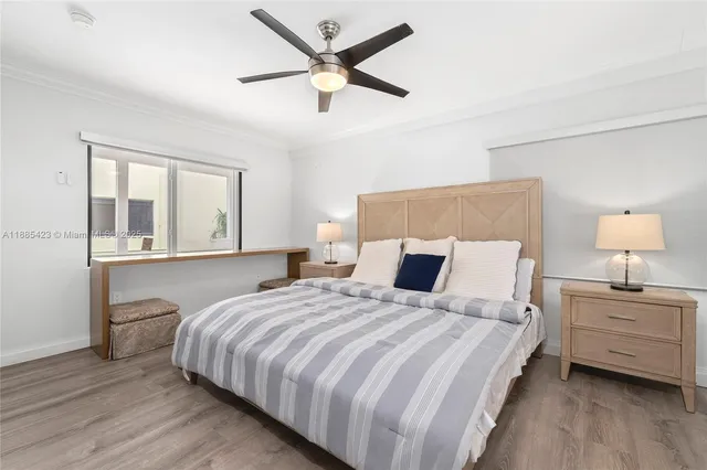 a bedroom with bed and window