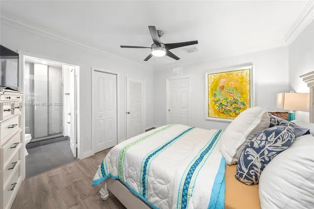 a bedroom with a bed and a dresser