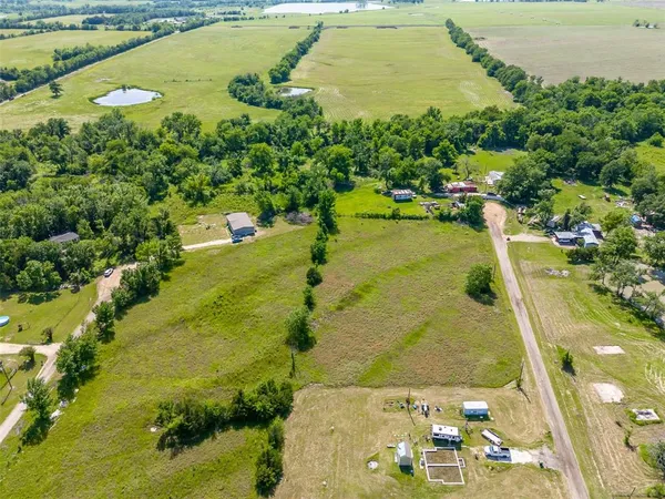 a view of a lake with a yard