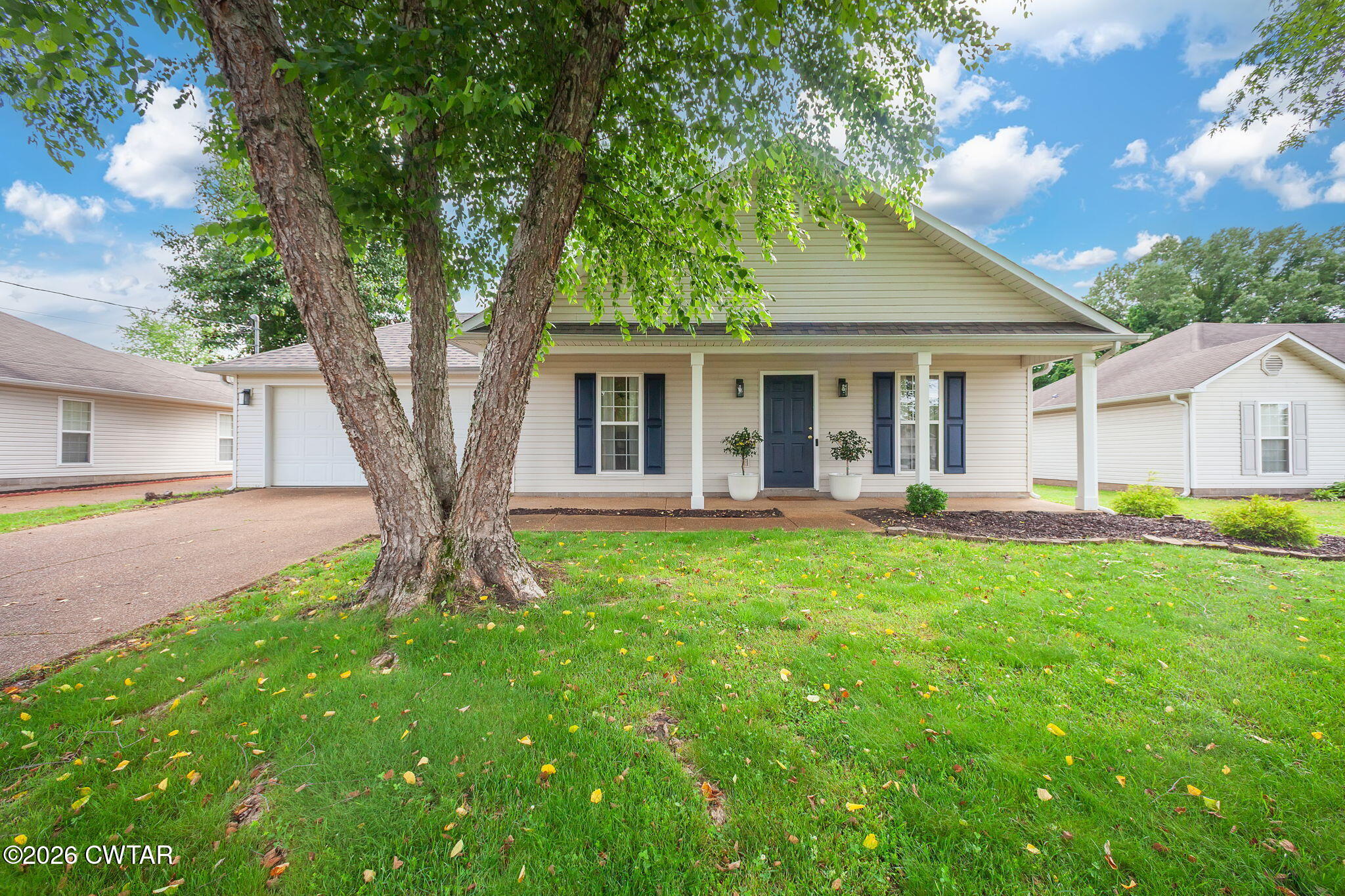 80 Rooker Drive Jackson, TN 38305 - Photo 28 of 30 a front view of house with yard and green space