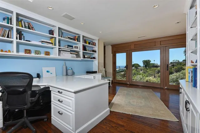 a view of workspace with furniture and window