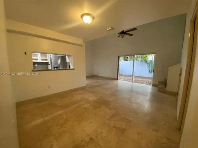 a view of a livingroom with a staircase