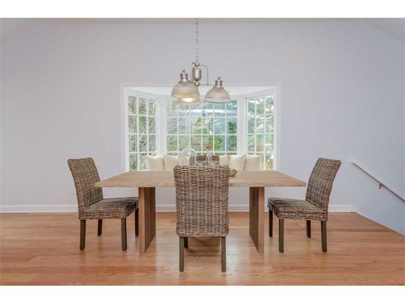 154 Middlesex Road Darien, CT 06820 - Photo 8 of 20 a dining room with furniture a chandelier and wooden floor