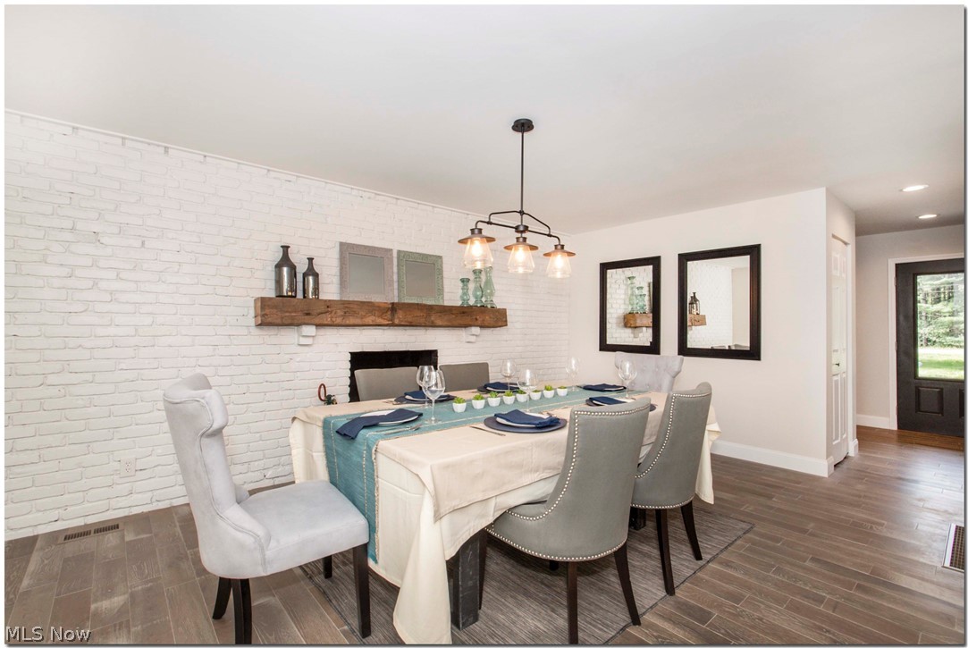 7911 Valley View Road Hudson, OH 44236 - Photo 10 of 35 dining room with real brick backdrop