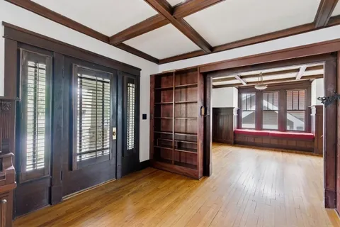a view of gallery with wooden floor