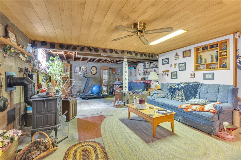 136 Kelley Road Industry, PA 15052 - Photo 11 of 35 a living room with furniture and a chandelier