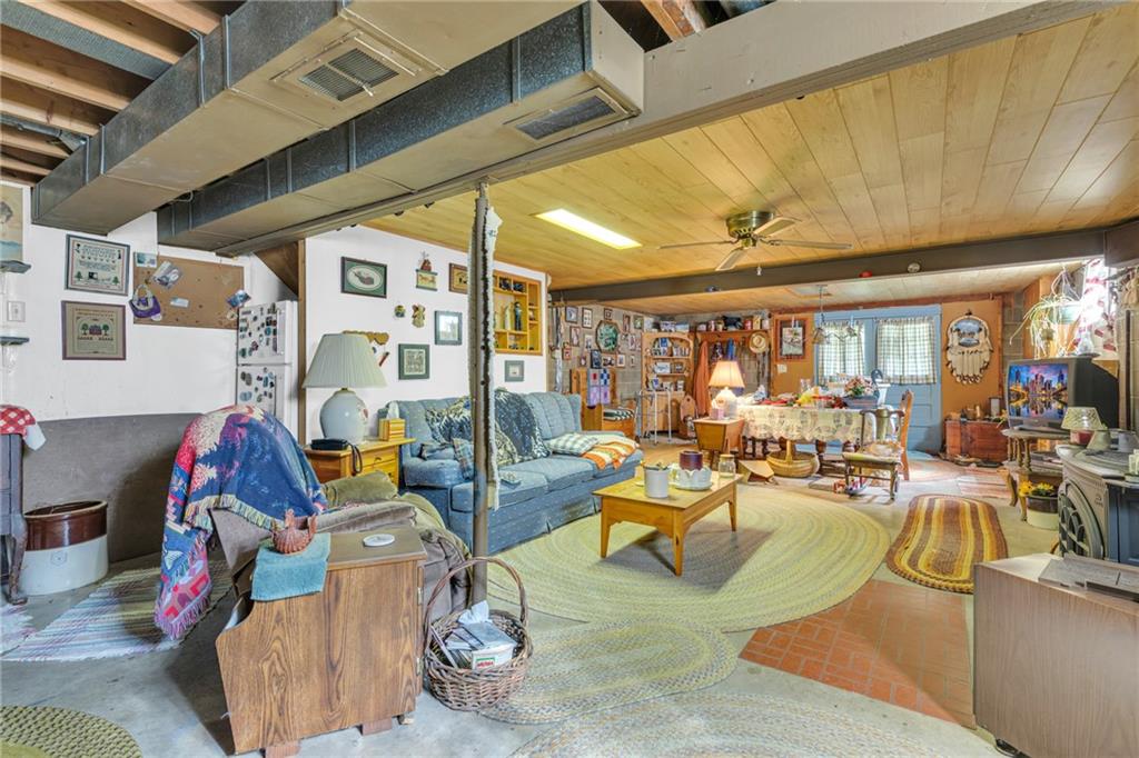 136 Kelley Road Industry, PA 15052 - Photo 13 of 35 a living room with lots of furniture and a chandelier