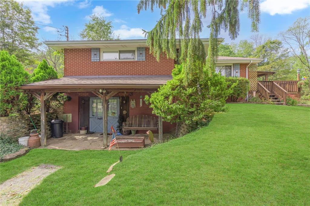 136 Kelley Road Industry, PA 15052 - Photo 15 of 35 a view of a house with garden and plants