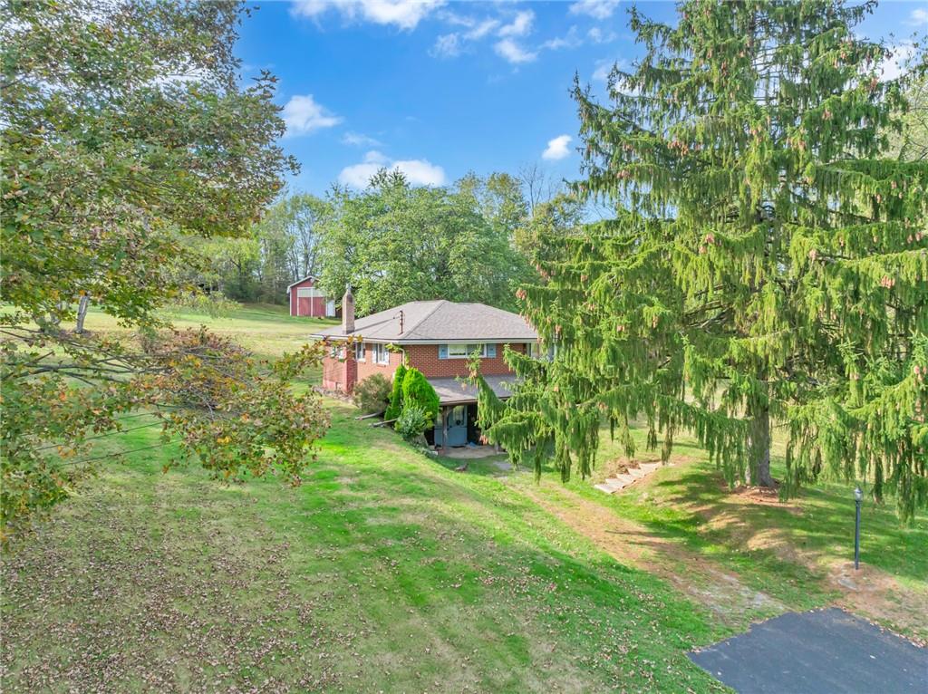 136 Kelley Road Industry, PA 15052 - Photo 22 of 35 a view of a garden with a bench