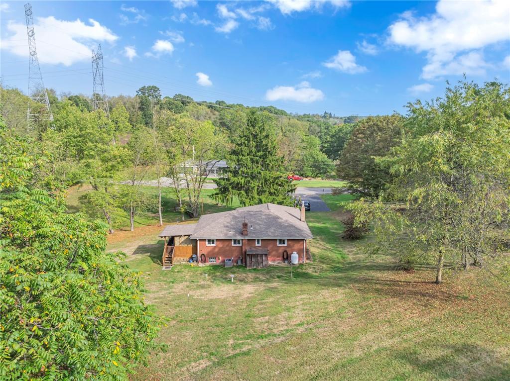 136 Kelley Road Industry, PA 15052 - Photo 26 of 35 a view of a big yard with potted plants and large tree