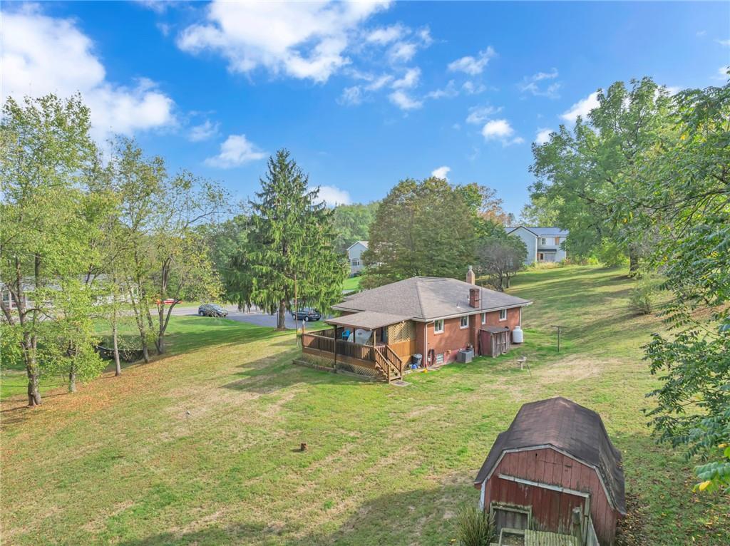 136 Kelley Road Industry, PA 15052 - Photo 30 of 35 a view of a house with a yard and sitting area