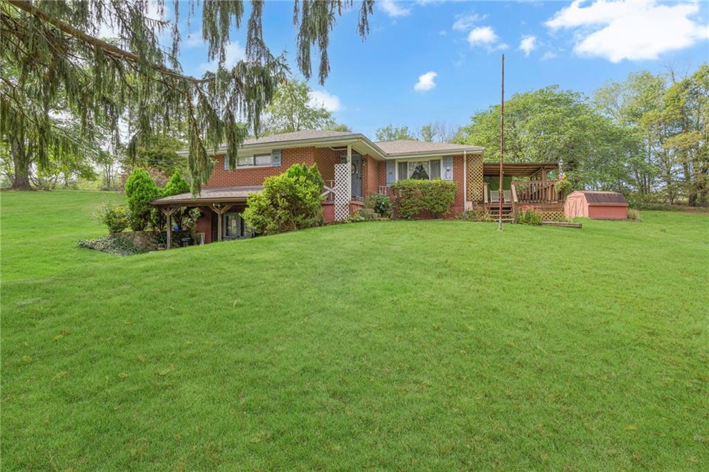 136 Kelley Road Industry, PA 15052 - Photo 31 of 35 a view of a house with backyard and sitting area