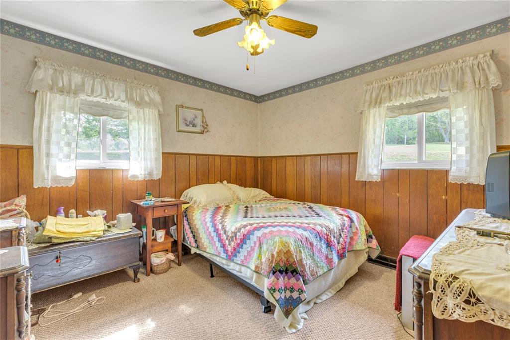 136 Kelley Road Industry, PA 15052 - Photo 8 of 35 a bed room with a bed and a window