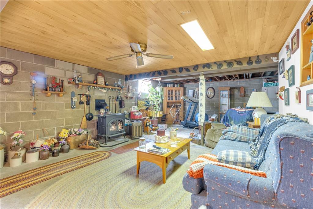 136 Kelley Road Industry, PA 15052 - Photo 10 of 35 a living room with lots of furniture and a chandelier