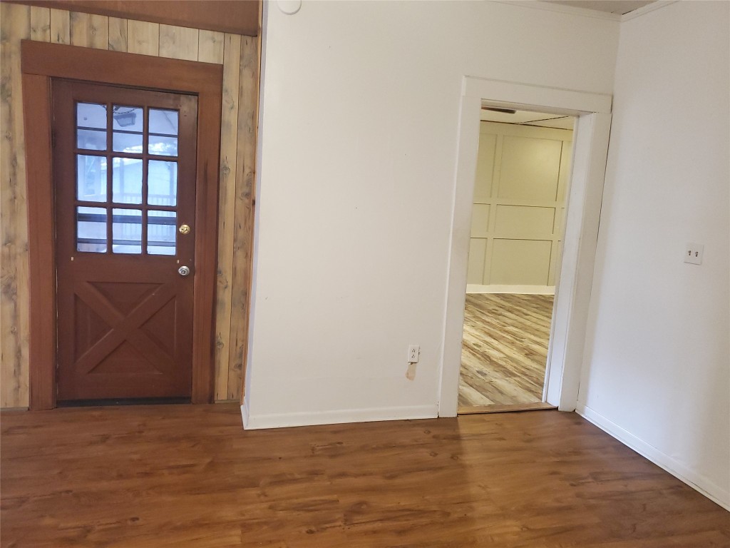 1233 Caldwell Road Angleton, TX 77515 - Photo 17 of 32 an empty room with wooden floor closet and windows