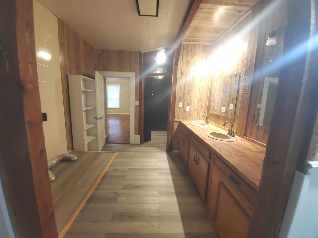 1233 Caldwell Road Angleton, TX 77515 - Photo 19 of 32 a bathroom with a sink and a mirror