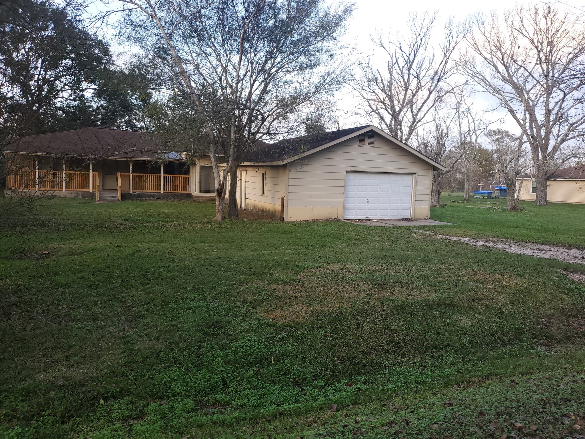 1233 Caldwell Road Angleton, TX 77515 - Photo 2 of 32 a front view of a house with a garden