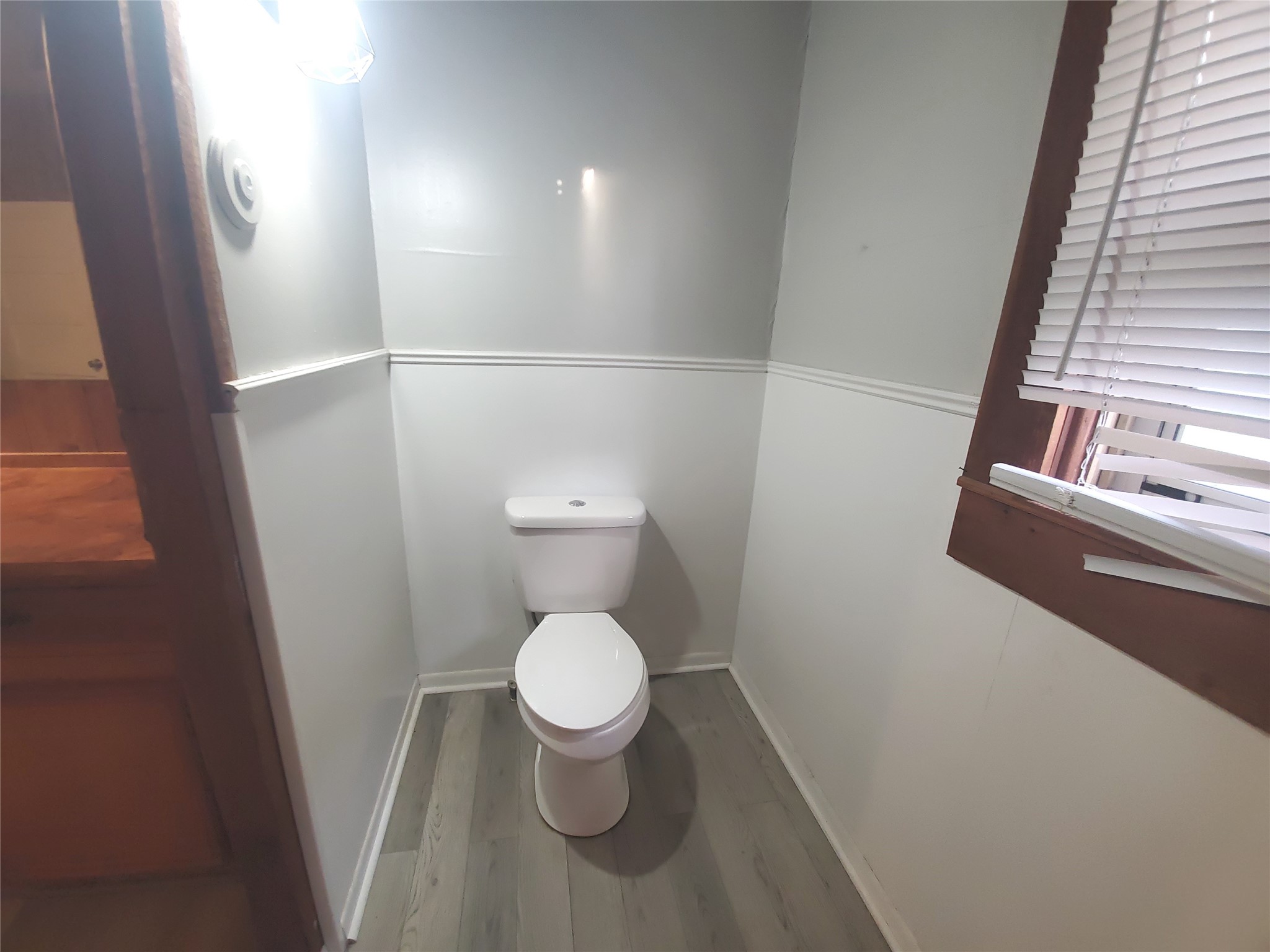 1233 Caldwell Road Angleton, TX 77515 - Photo 21 of 32 a bathroom with a toilet and a mirror