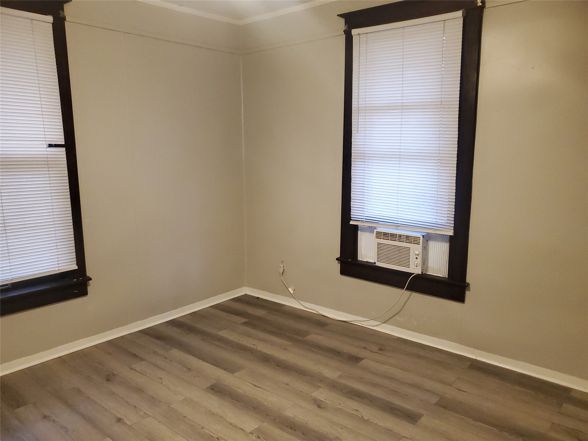 1233 Caldwell Road Angleton, TX 77515 - Photo 25 of 32 a view of a small space with wooden floor and a window