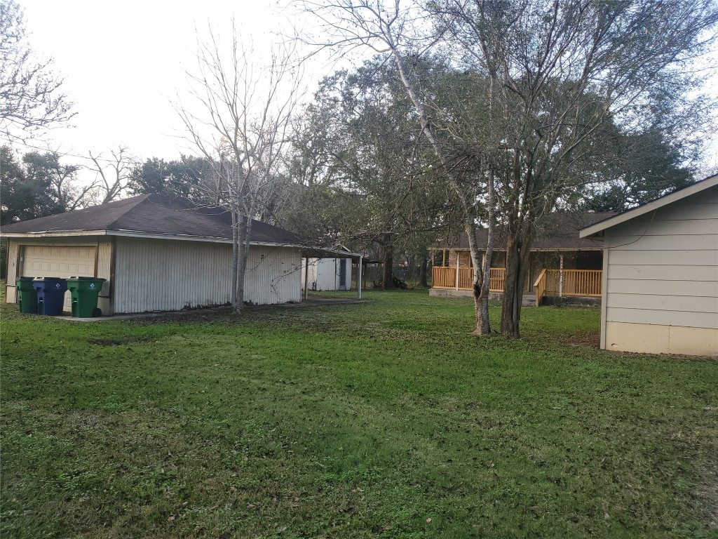 1233 Caldwell Road Angleton, TX 77515 - Photo 4 of 32 a view of a house with a back yard