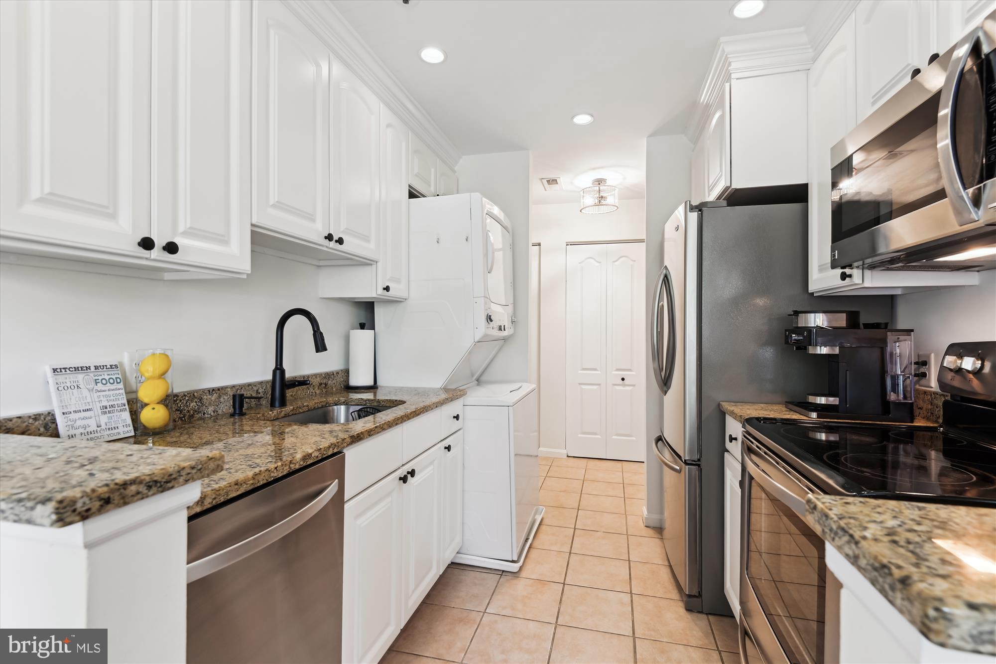 8369 Montgomery Run Road, Unit J Ellicott City, MD 21043 - Photo 15 of 40 RECESSED LIGHTS, WHITE CABINETRY W/ MOLDING, & W/D