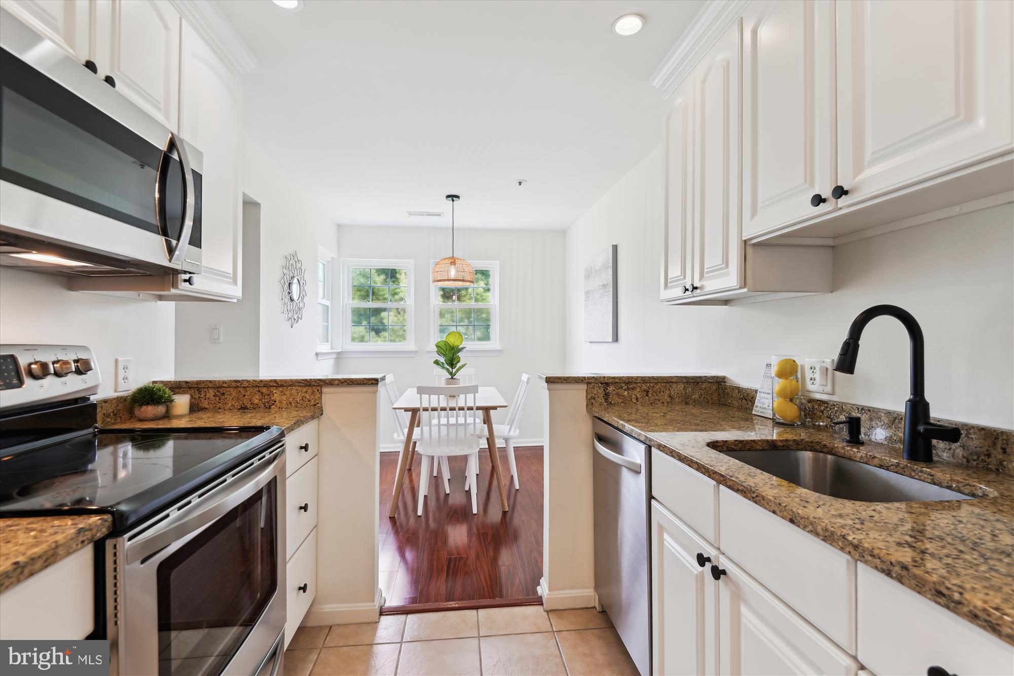 8369 Montgomery Run Road, Unit J Ellicott City, MD 21043 - Photo 16 of 40 GRANITE COUNTERTOPS & CERAMIC TILE FLOORING