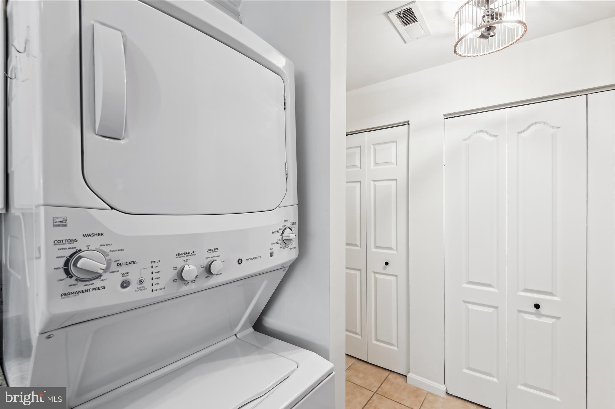 8369 Montgomery Run Road, Unit J Ellicott City, MD 21043 - Photo 30 of 40 STACKED WASHER & DRYER IN KITCHEN