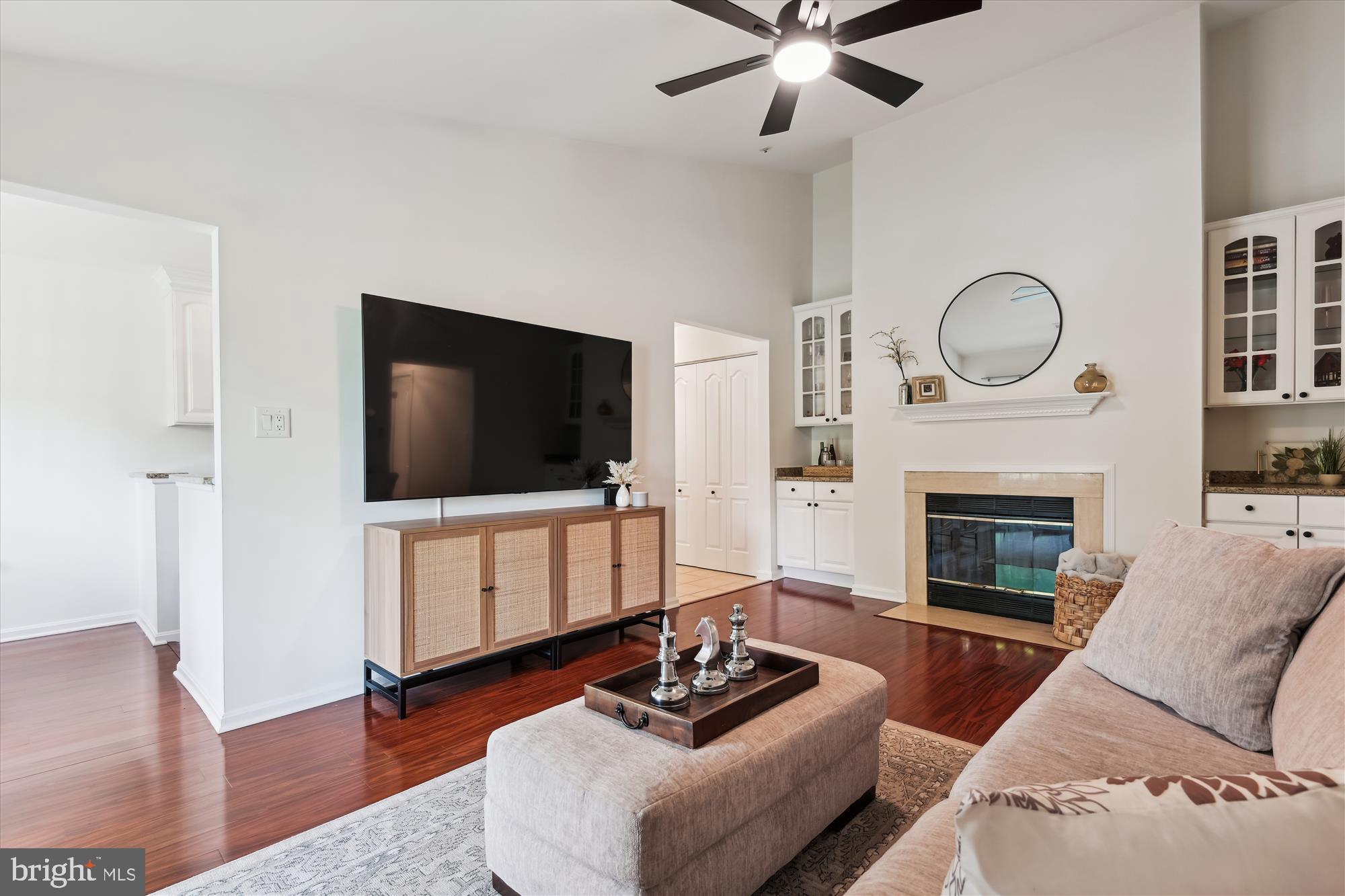 8369 Montgomery Run Road, Unit J Ellicott City, MD 21043 - Photo 6 of 40 GLEAMING HARDWOODS IN COMFORTABLE LIVING ROOM
