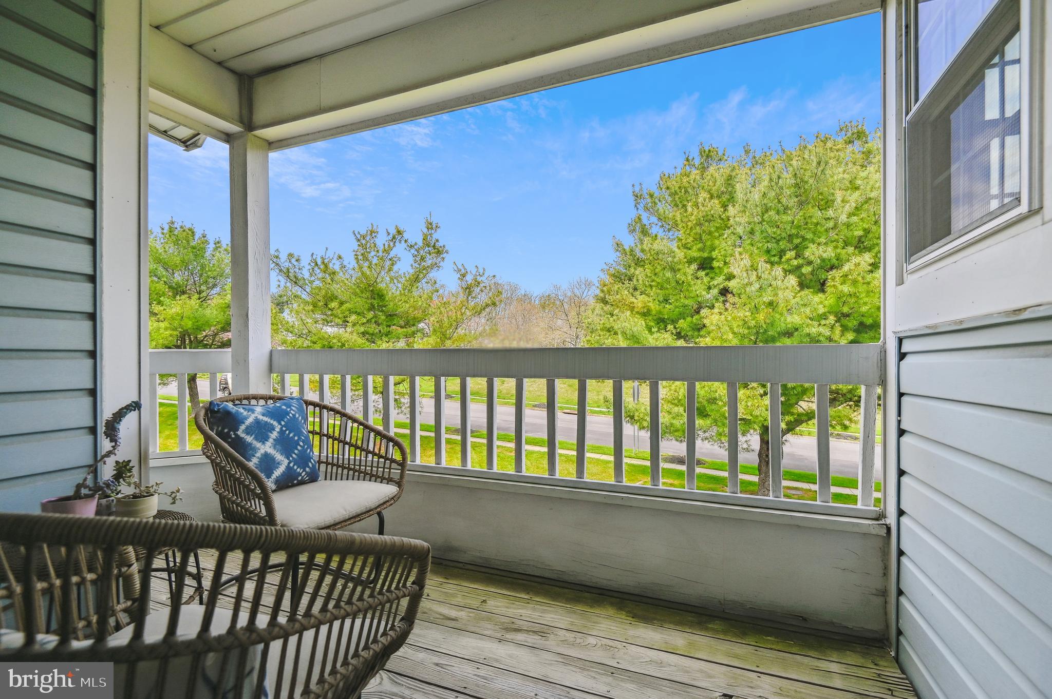 8369 Montgomery Run Road, Unit J Ellicott City, MD 21043 - Photo 10 of 40 COVERED WOOD PORCH W/ PEACEFUL VIEWS