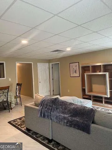 a living room with a couch and a flat screen tv