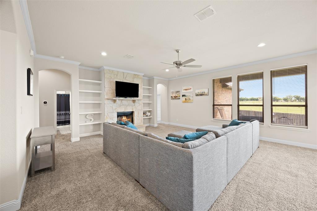 2618 Byrd Ranch Road Midlothian, TX 76065 - Photo 9 of 38 a living room with furniture and a flat screen tv