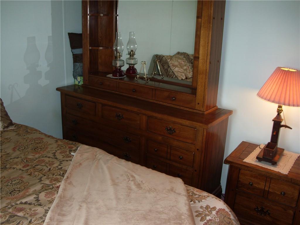 340 Deerfield Road Washington, PA 15301 - Photo 19 of 36 a bedroom with a bed and a lamp on dresser