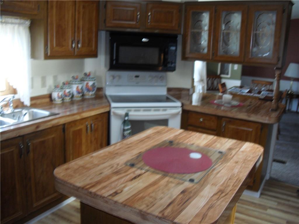 340 Deerfield Road Washington, PA 15301 - Photo 9 of 36 a kitchen with a stove and a microwave