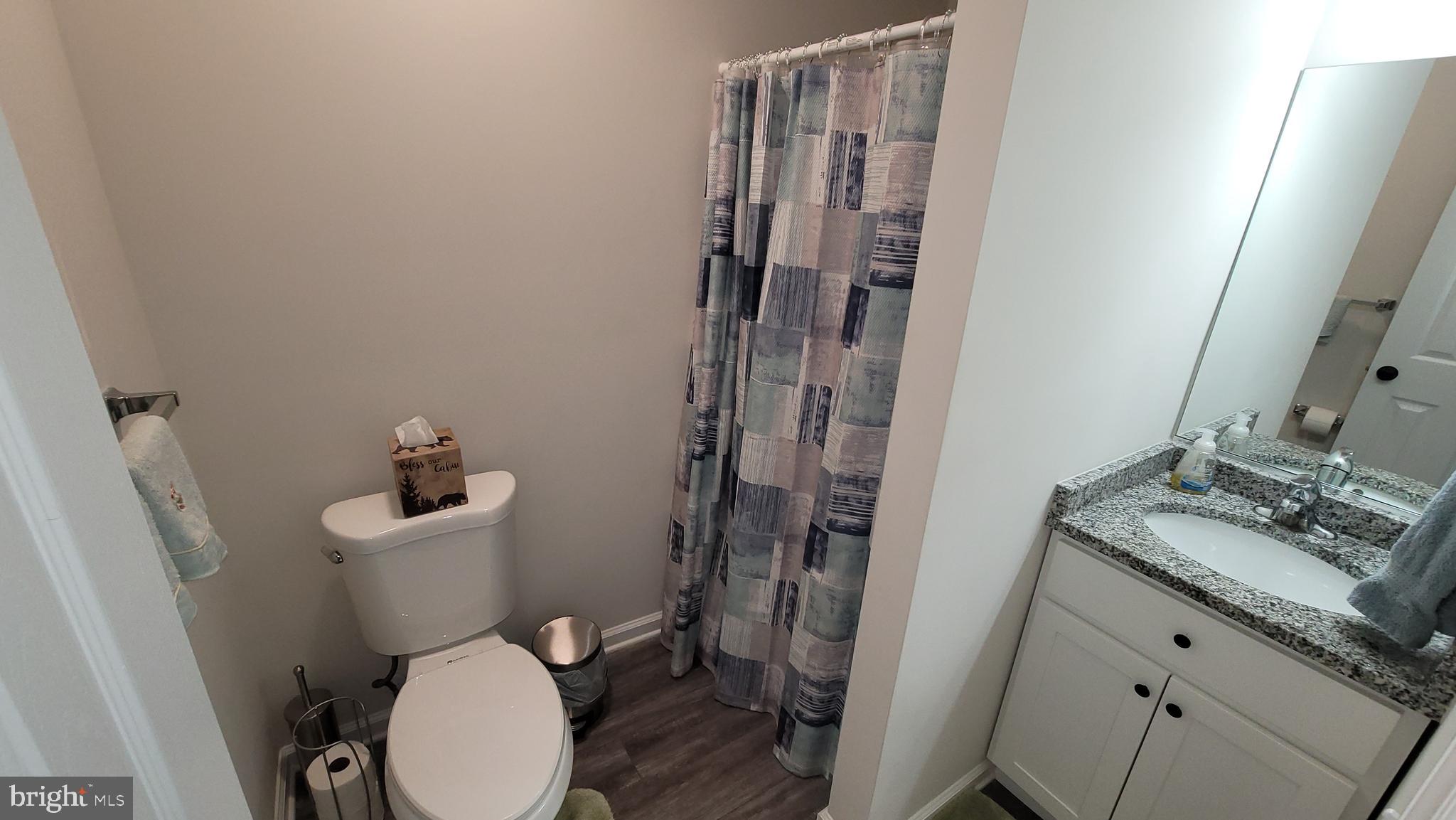 126 Metcalf Road Chestertown, MD 21620 - Photo 15 of 25 a white toilet sitting next to a bathroom sink