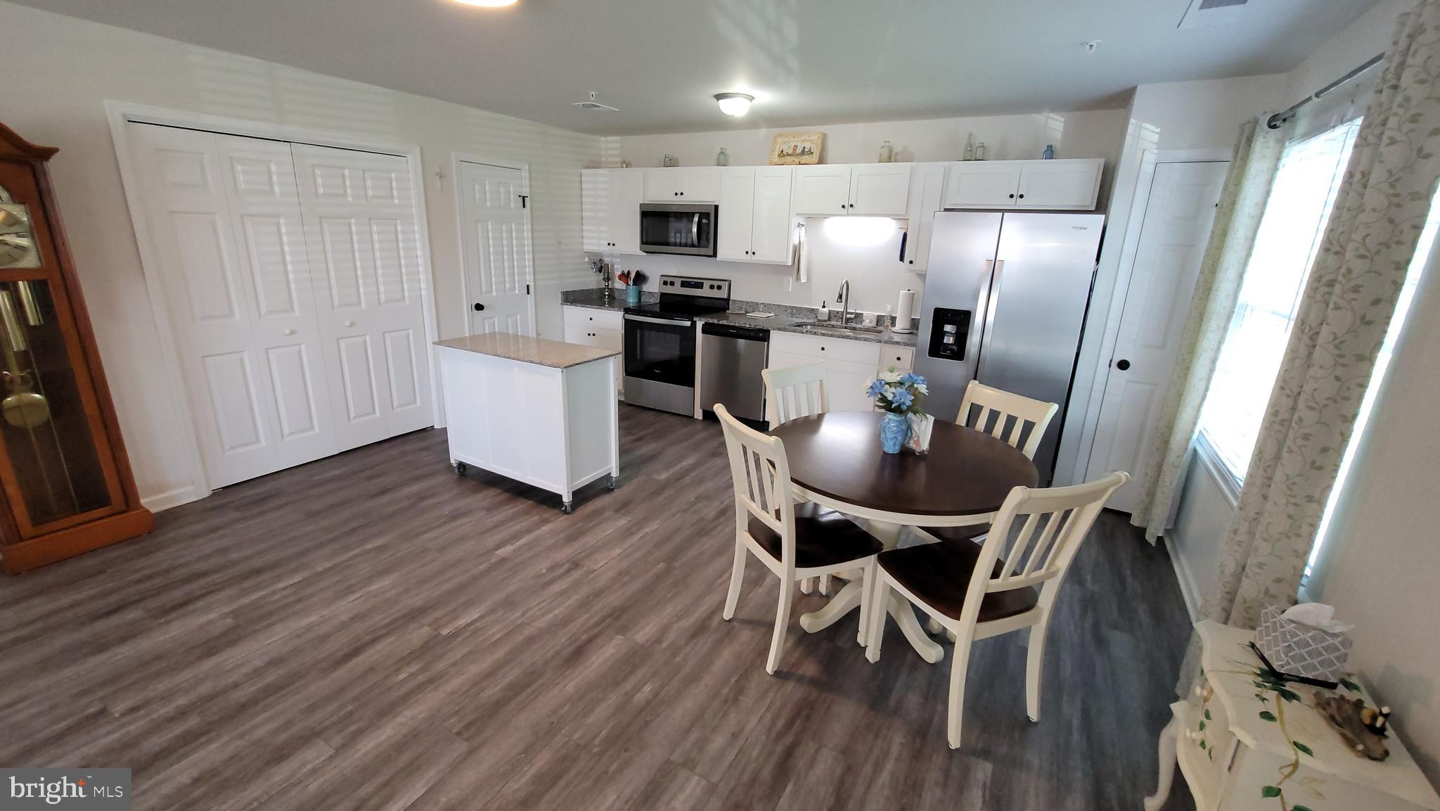 126 Metcalf Road Chestertown, MD 21620 - Photo 6 of 25 a view of a dining room with furniture and wooden floor