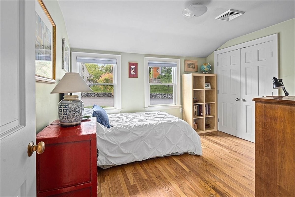 25 Howland Lane Hingham, MA 02043 - Photo 24 of 34 a bedroom with a bed and wooden floor