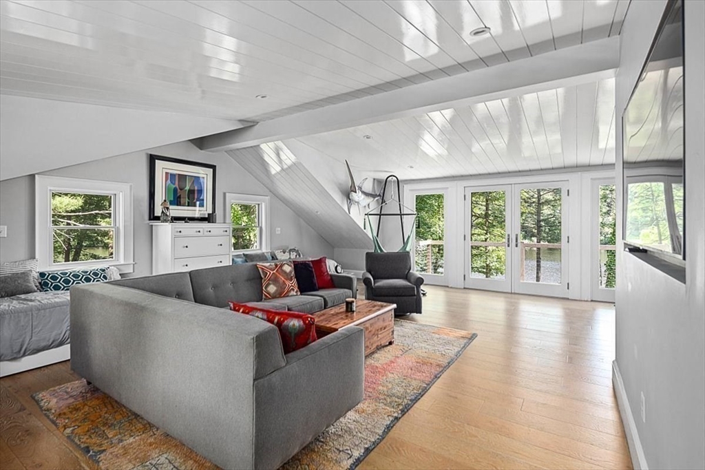 25 Howland Lane Hingham, MA 02043 - Photo 26 of 34 a living room with furniture and a large window