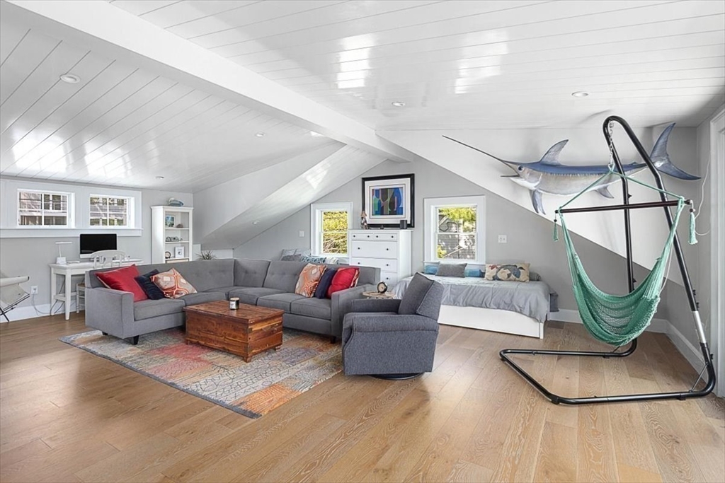 25 Howland Lane Hingham, MA 02043 - Photo 28 of 34 a living room with furniture and a wooden floor