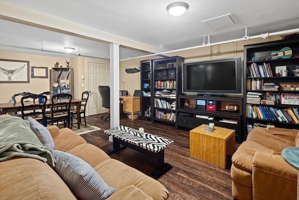 25 Howland Lane Hingham, MA 02043 - Photo 30 of 34 a living room with furniture and a flat screen tv