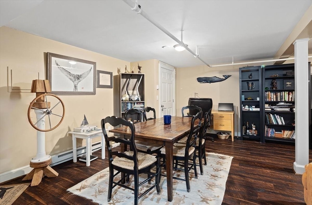 25 Howland Lane Hingham, MA 02043 - Photo 31 of 34 a view of a dining room with furniture and wooden floor