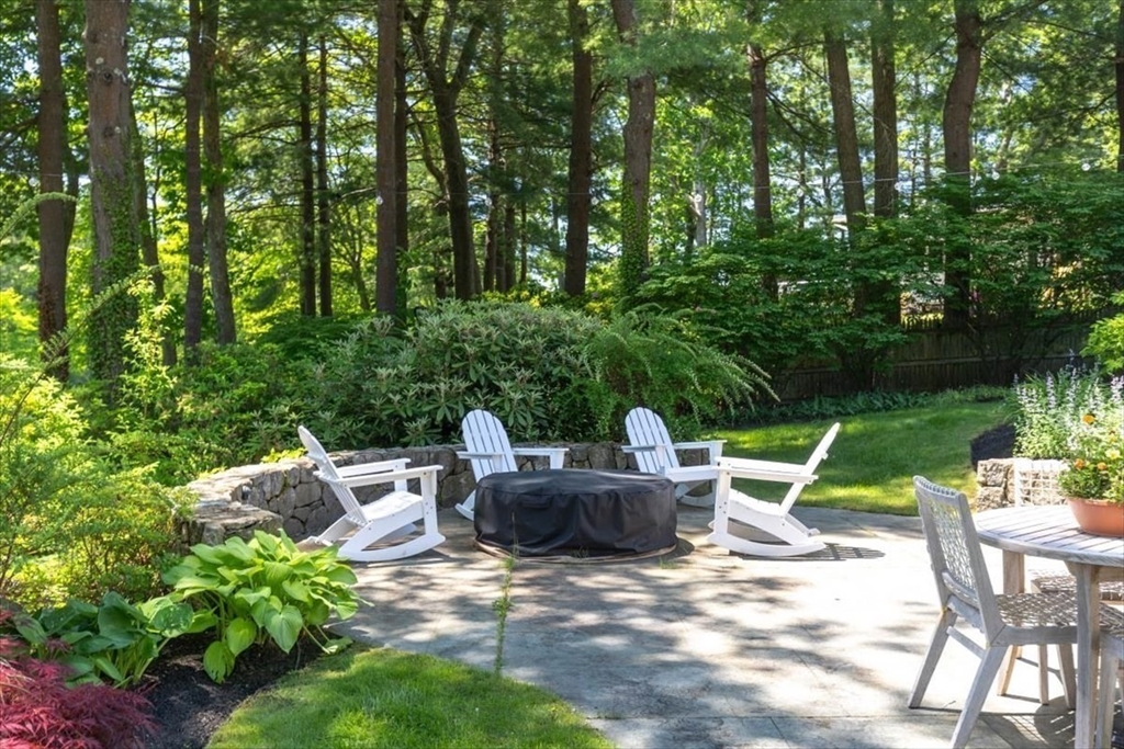 25 Howland Lane Hingham, MA 02043 - Photo 9 of 34 a backyard of a house with fountain table and chairs