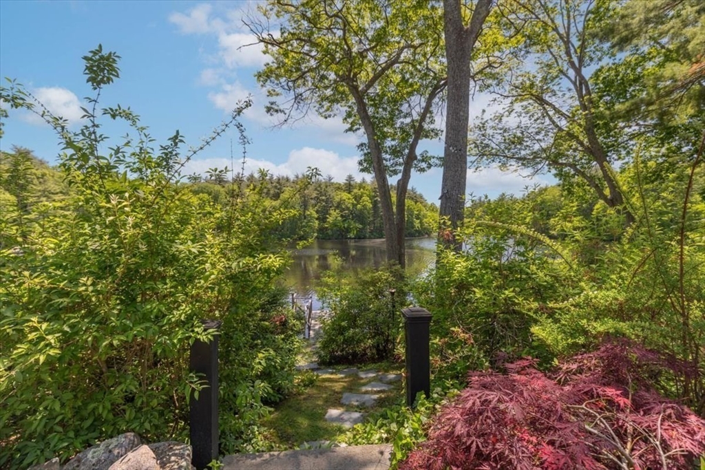 25 Howland Lane Hingham, MA 02043 - Photo 10 of 34 a backyard of a house with lots of green space