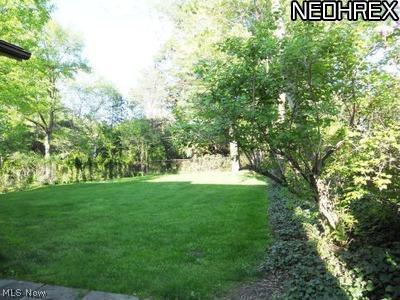 1945 Temblethurst Road South Euclid, OH 44121 - Photo 14 of 15 Patio Overlooks Lush Park-like, Partially Fenced Large Backyard