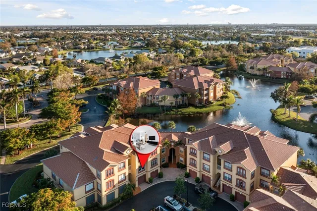 an aerial view of a house with a ocean view