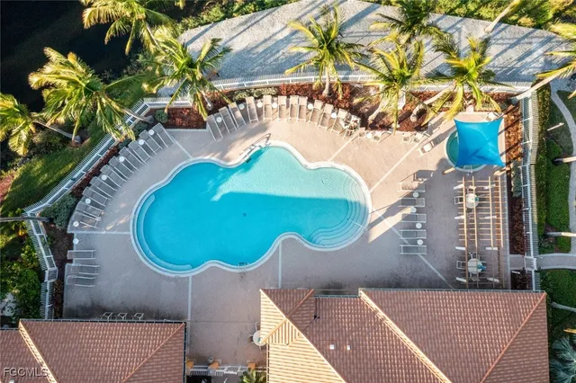 a view of a swimming pool with sitting area