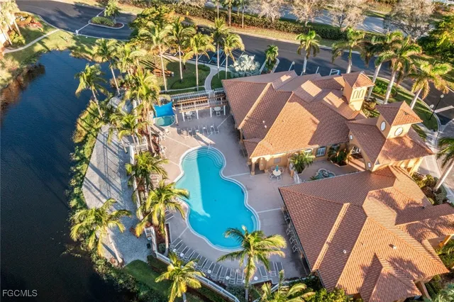 an aerial view of a house with a yard and garden