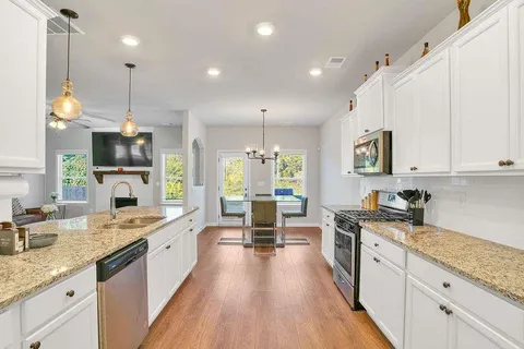 a large kitchen with granite countertop lots of counter top space