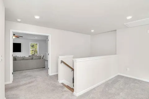 a view of living room kitchen with furniture and flat screen tv