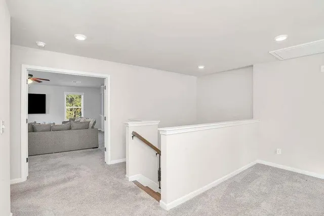 a view of living room kitchen with furniture and flat screen tv
