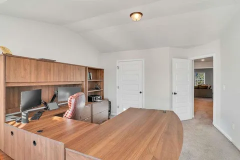 a bed room with a bed and a chair